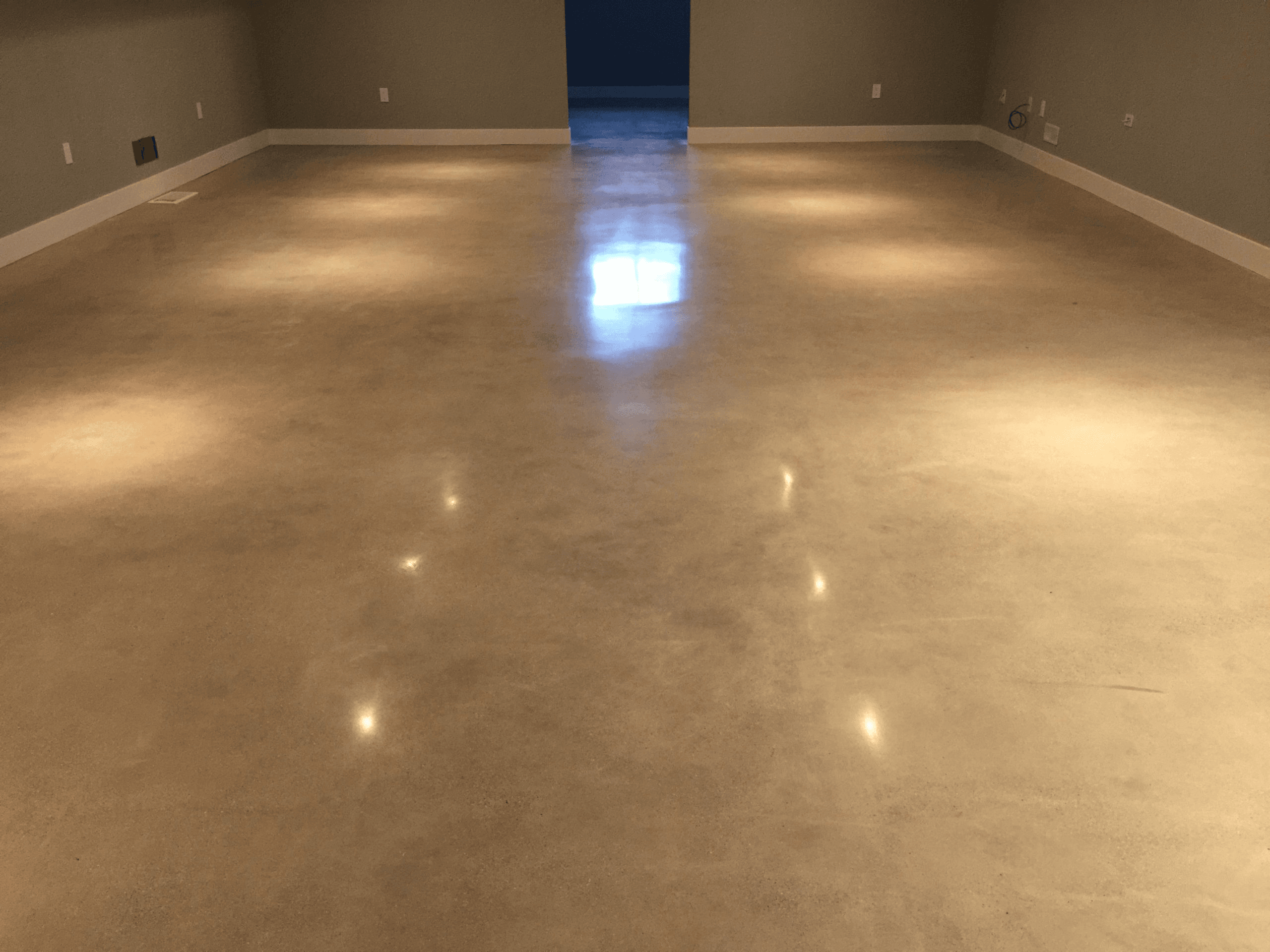 Epoxy floor coating applied in a residential basement in Hamilton, Ontario
